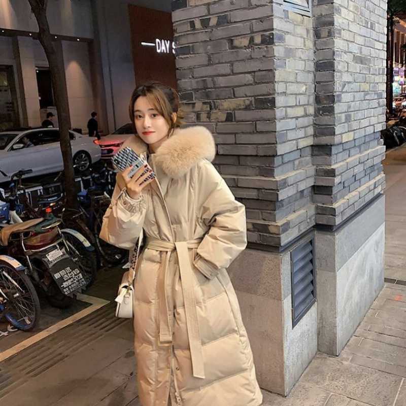Milk tea color Down jacket women's long over knee thickened warm belt fox fur real fur collar white duck down Xia Shiwen